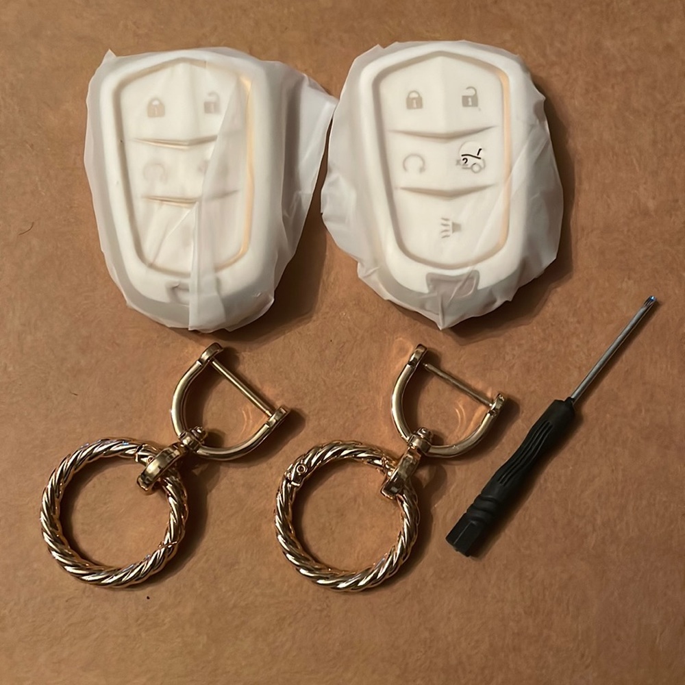 Two Cadillac Fob Cases